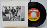 Vinyl record and cover with Columbia label and black and white photo of a person on a porch.