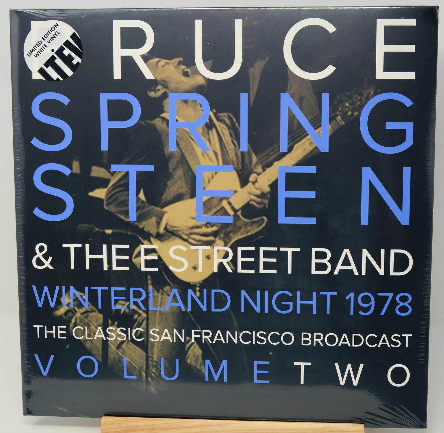 Ruce Springsteen & The Street Band 'Winterland Night 1978' vinyl record cover, Volume Two, with a dark blue background, large white and blue text, and a photo of a musician playing guitar.