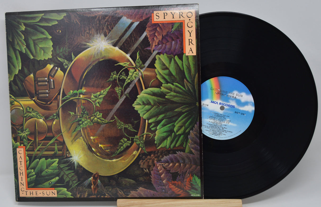 Vinyl record 'Spyro Gyra Catching The Sun' with colorful cover featuring nature-themed design