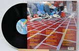 Vinyl record 'Spyro Gyra City Kids' with a colorful album cover featuring sneakers and a grid pattern.