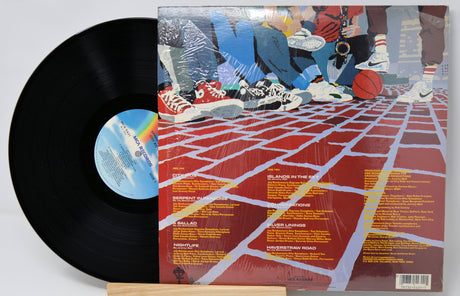 Vinyl record 'Spyro Gyra City Kids' with a colorful album cover featuring sneakers and a grid pattern.