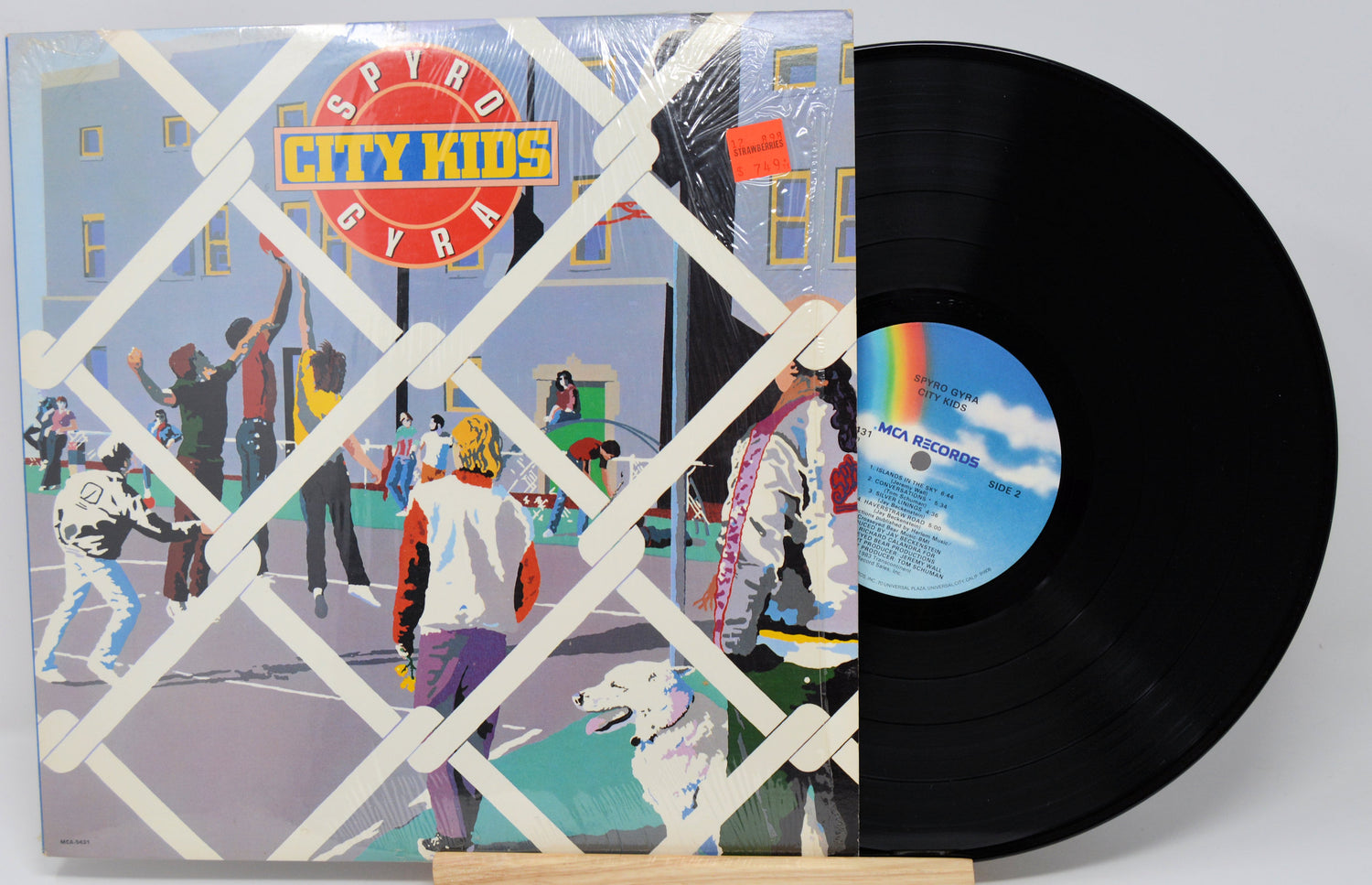 Vinyl record with colorful cover featuring 'Spyro Gyra City Kids' and a white background