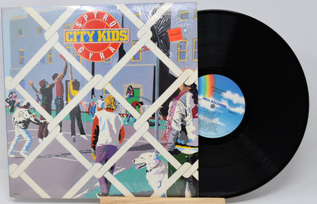 Vinyl record with colorful cover featuring 'Spyro Gyra City Kids' and a white background
