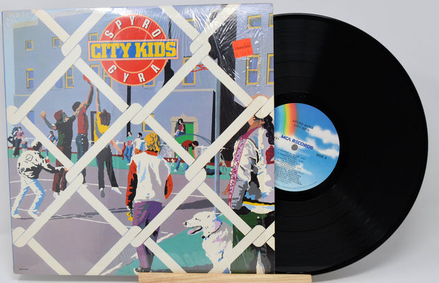 Vinyl record with colorful cover featuring 'Spyro Gyra City Kids' and a white background