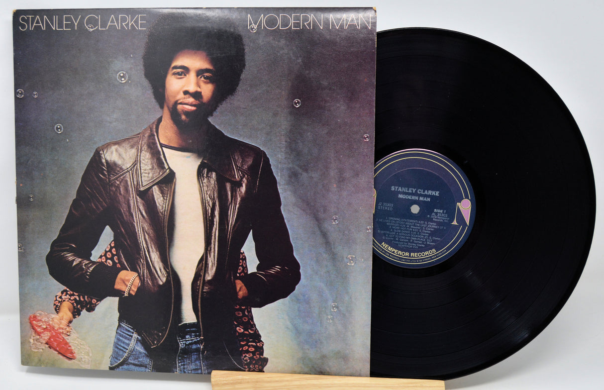 Vinyl record with cover featuring a person, 'Modern Man' by Stanley Clarke