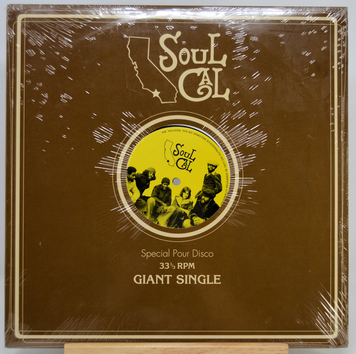 A sealed vinyl record sleeve for the Soul Cal 'Special Pour Disco' 33 1/3 RPM Giant Single, featuring a brown cover with a yellow record graphic and cream text, photographed on a light background.