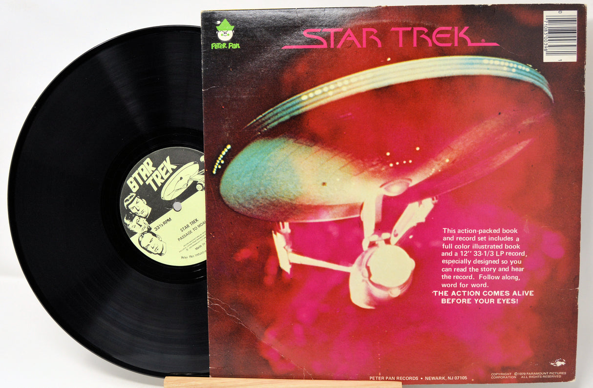 Vinyl record with 'Star Trek' cover featuring a spaceship and character.