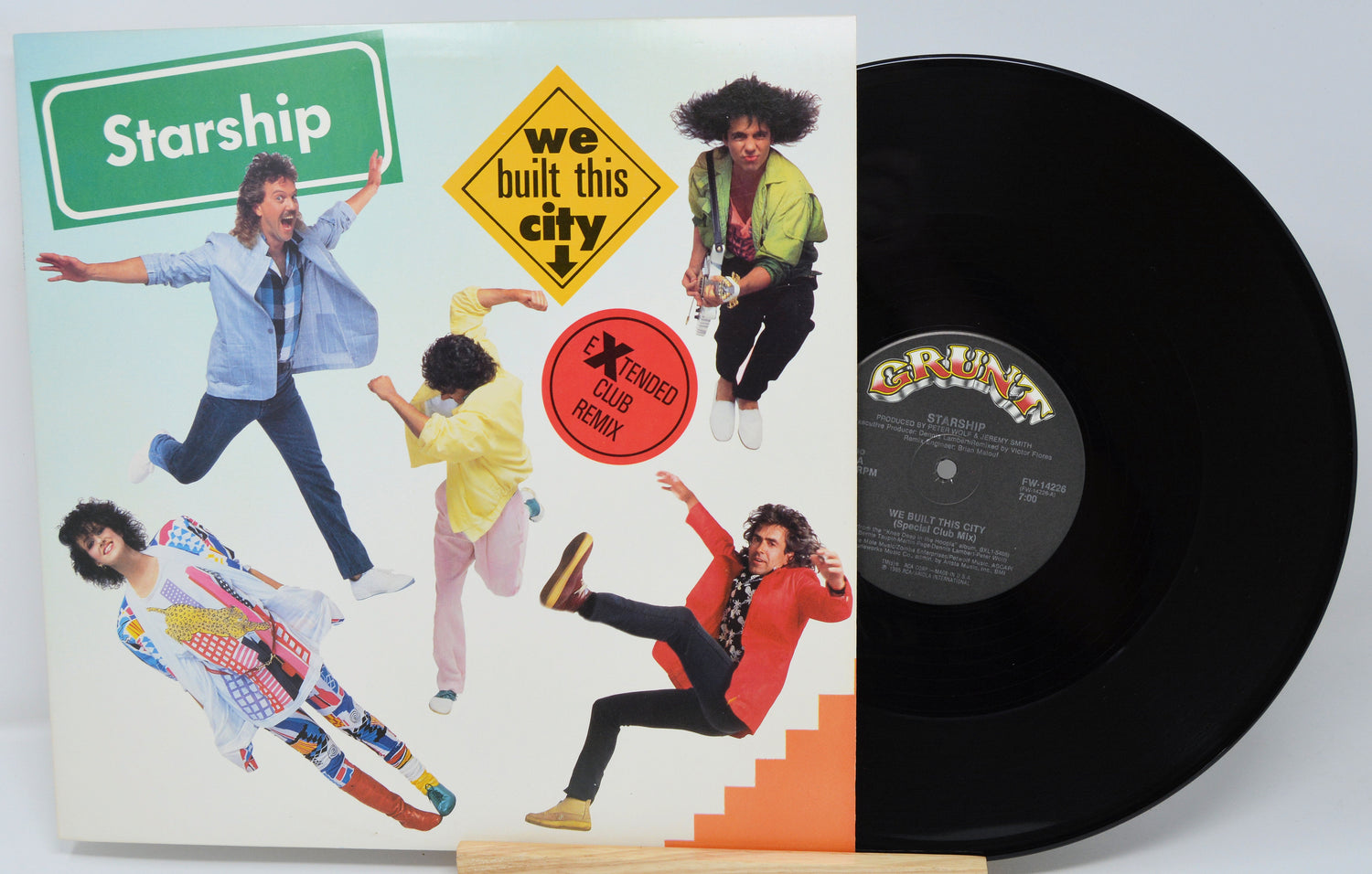 Vinyl record with 'Starship' album cover showing band members and colorful design.
