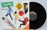 Vinyl record with 'Starship' album cover showing band members and colorful design.