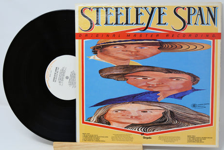 A vinyl record partially pulled from its album cover, showing the black record on the left and the cover on the right. The cover features the title 'Steeleye Span' in large stylized lettering above an illustrated portrait collage on a light background.