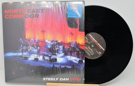 Front cover and vinyl record of Steely Dan's Northeast Corridor Live! album showing a concert stage with band