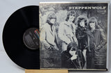 Vinyl record with Steppenwolf album cover featuring band members outdoors.