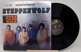 Vinyl record with 'Steppenwolf' album cover featuring band members and text.