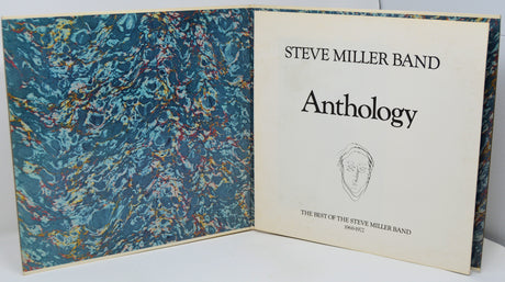 Book titled 'Anthology' by Steve Miller Band with a blue marbled cover.