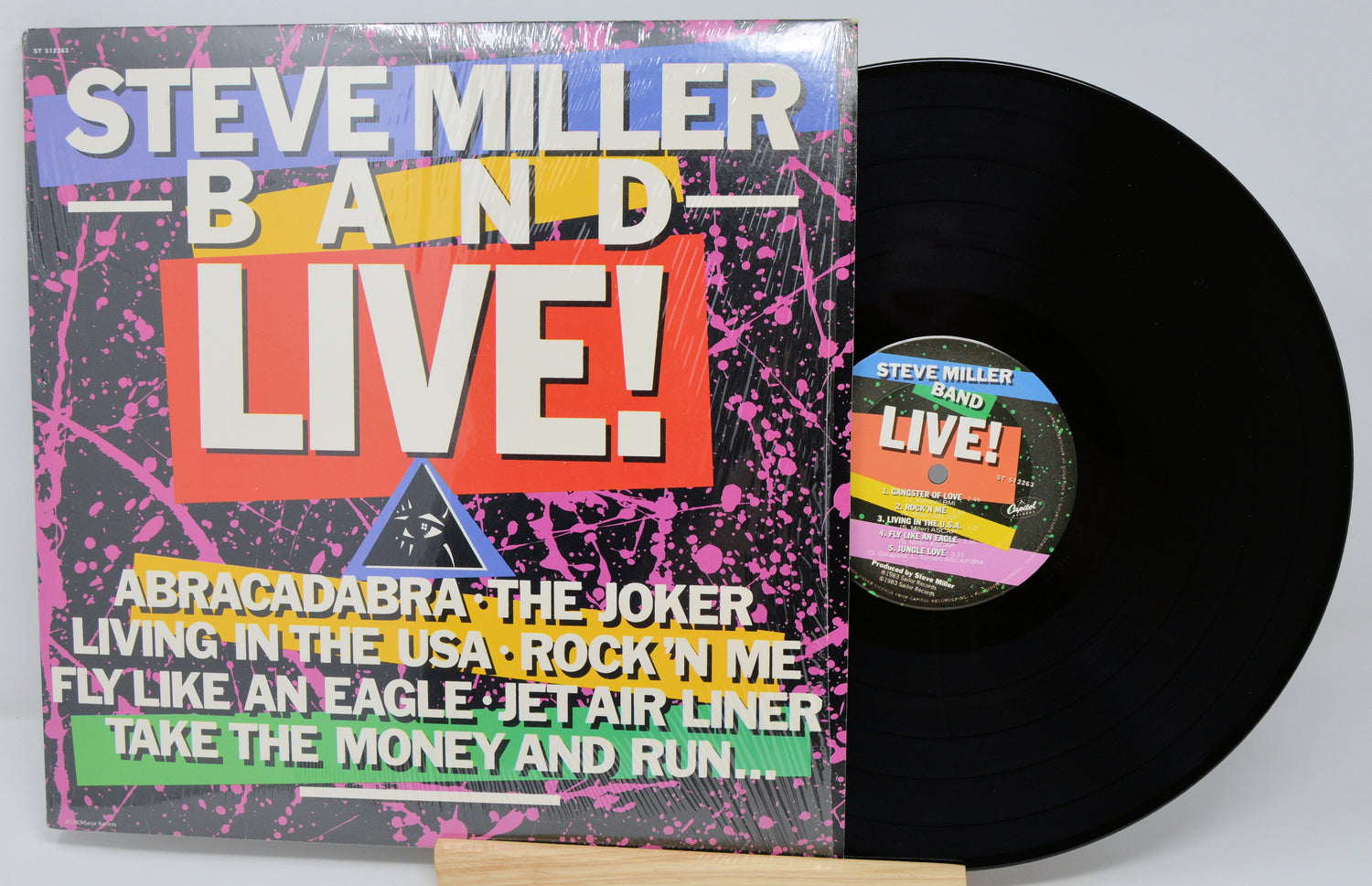 Vinyl record with colorful cover featuring 'Steve Miller Band Live!' text and tracklist.