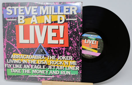 Vinyl record with colorful cover featuring 'Steve Miller Band Live!' text and tracklist.