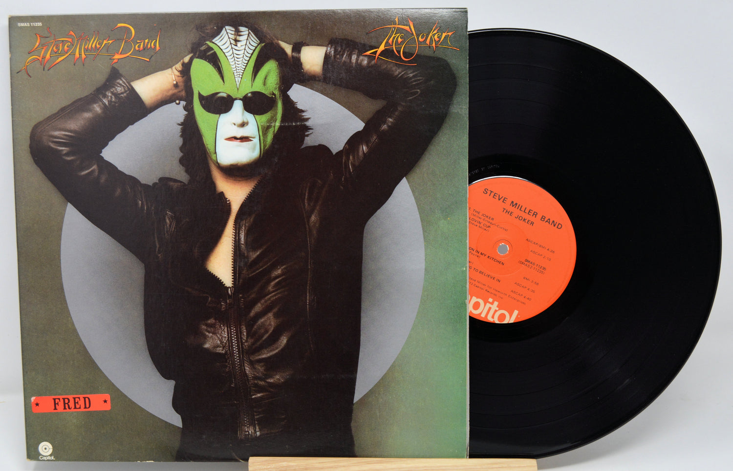 Vinyl record by Steve Miller, title The Joker with a person wearing a mask and leather jacket on the front cover