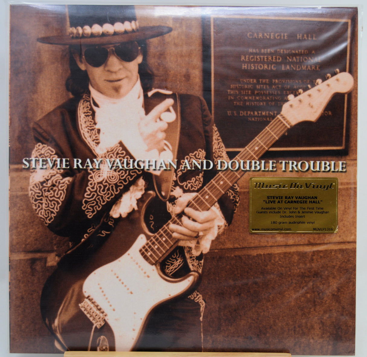 Vinyl record album cover for Stevie Ray Vaughan and Double Trouble, featuring a sepia-toned portrait of Stevie Ray Vaughan in a cowboy hat and sunglasses while playing an electric guitar, with the album title in white text and a gold hype sticker.