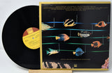 Vinyl record with a colorful fish illustration on the cover