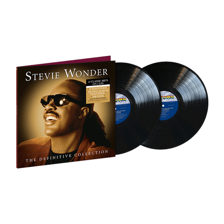 Two black vinyl records and the front cover for 'The Definitive Collection' by Stevie Wonder with a headshot picture of him.