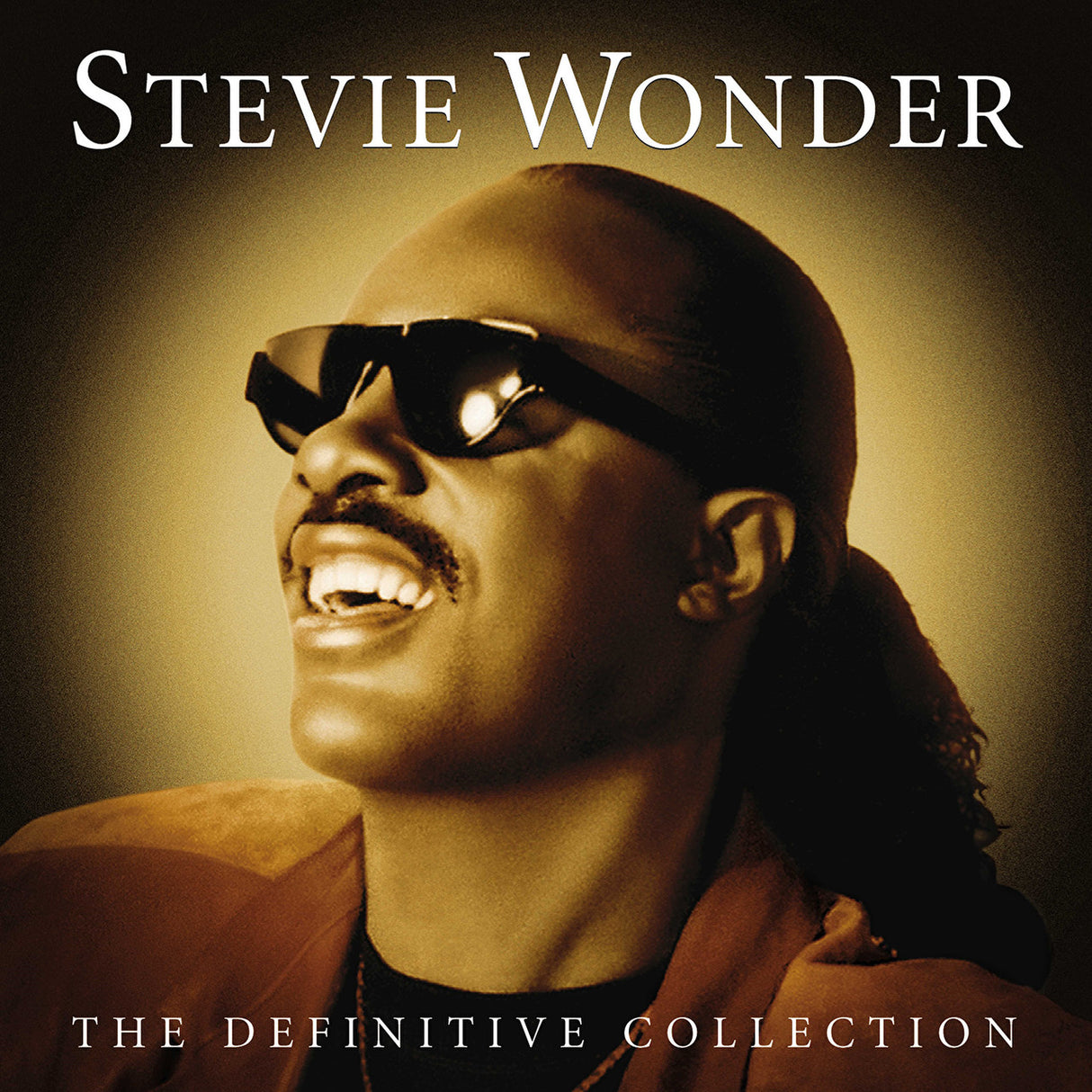 Stevie Wonder album cover for 'The Definitive Collection' featuring a photo of Stevie Wonder with sunglasses on, smiling, against a warm-toned background.