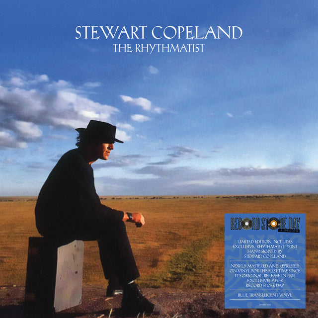 Album cover titled 'The Rhythmatist' with Stewart Copeland on a stool in a field, under a blue sky with clouds.