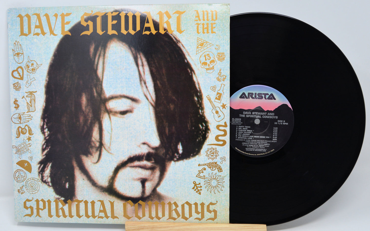 Vinyl record with cover featuring a portrait and 'Arista' label