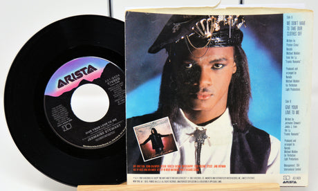 Vinyl record and its cover featuring a person with a crown on a white background