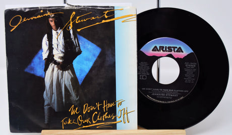 Vinyl record with cover featuring a person in a white outfit and 'Arista' label.