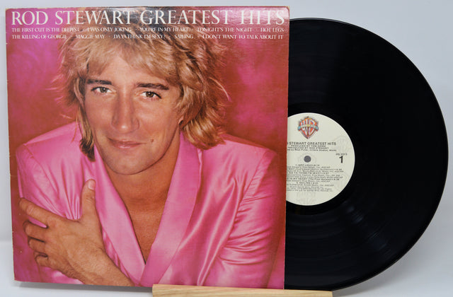 Vinyl record with cover featuring Rod Stewart's face and album title 'Greatest Hits'.