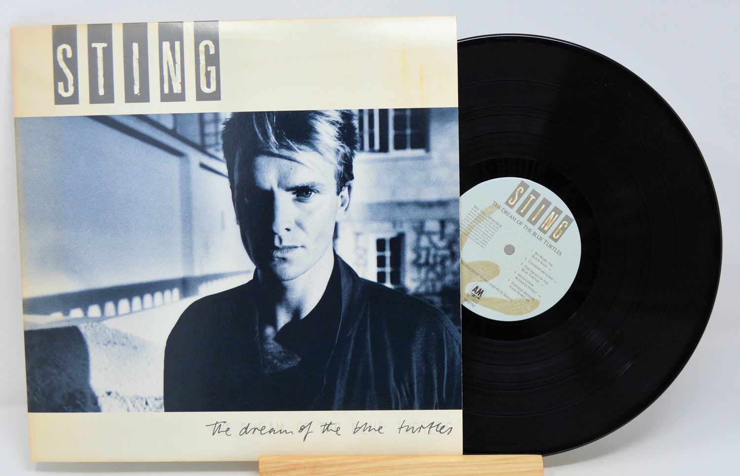 Vinyl record with Sting album cover featuring a portrait of a person.