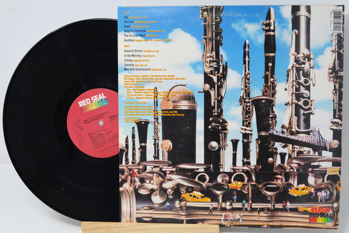 Vinyl record with a colorful album cover featuring musical instruments.