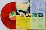 Vinyl record with colorful cover and text on a white background