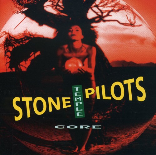 Core album cover of Stone Temple Pilots featuring a red-tinted image of a woman holding a glowing orb beneath a tree