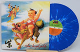 Vinyl record with colorful cover featuring a child riding a dragon and blue vinyl disc.