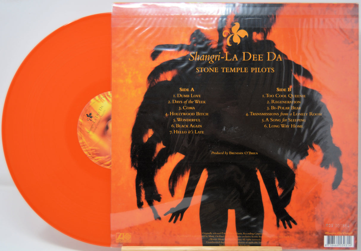 Orange vinyl record with a black silhouette cover featuring 'Stone Temple Pilots' album art.