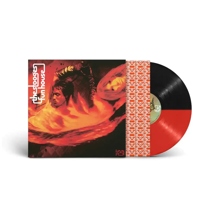 Vinyl record with a red and black cover featuring artistic design