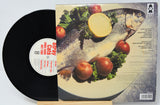 Vinyl record with a fish and fruit illustration on the cover