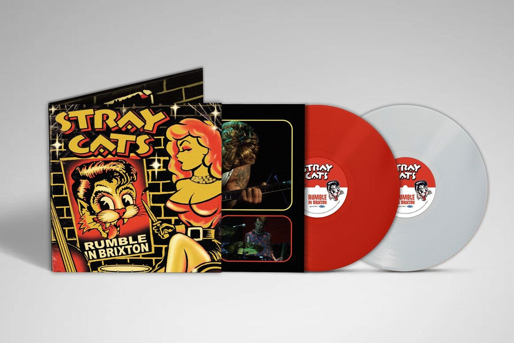 Vinyl record with 'Stray Cats' album cover featuring a red and white design.