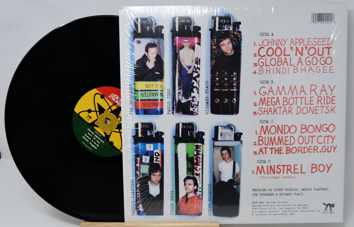 Vinyl record with a cover featuring images of people and text on a white background