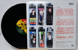 Vinyl record with a cover featuring images of people and text on a white background