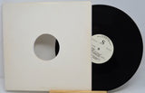 Vinyl record with a white label and beige sleeve on a white background
