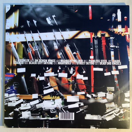 Back cover of Sunset Mission LP showing tracklist and blurred firearms art