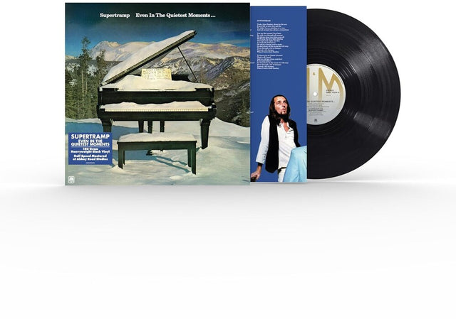 Vinyl record with cover featuring a grand piano and mountain landscape
