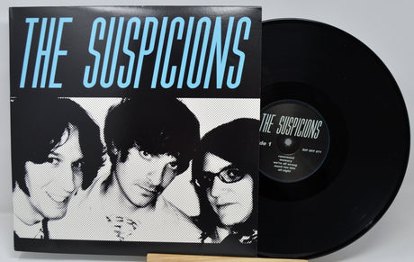 Vinyl record and cover titled 'The Suspicions' with black and white portrait on cover