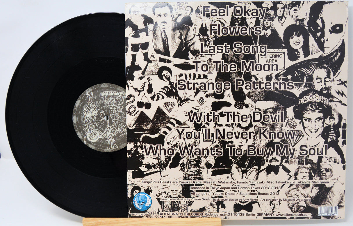 Vinyl record with a collage cover featuring text and images.
