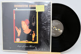 Vinyl record with cover featuring a person and text on a white background
