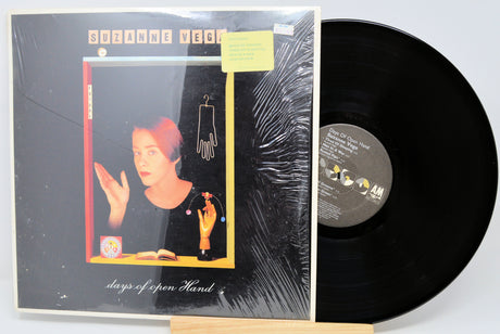 Vinyl record with cover featuring a person and text on a white background