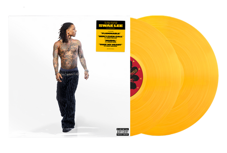 Vinyl record with a yellow cover and a person standing next to it on a white background