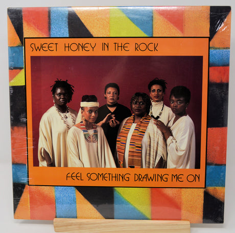 Album cover of 'Sweet Honey in the Rock' with a colorful border and portrait of six people.